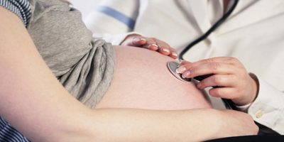 Doctor examining a pregnant woman