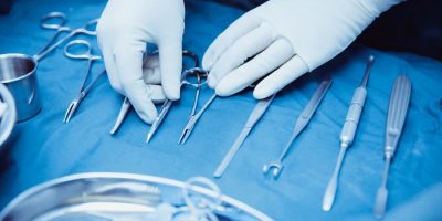 surgical-nurse-arranging-surgical-tools-in-operating-room